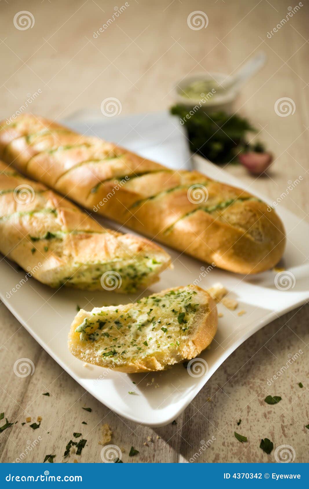 Baguettes with herb butter stock photo. Image of eating 4370342
