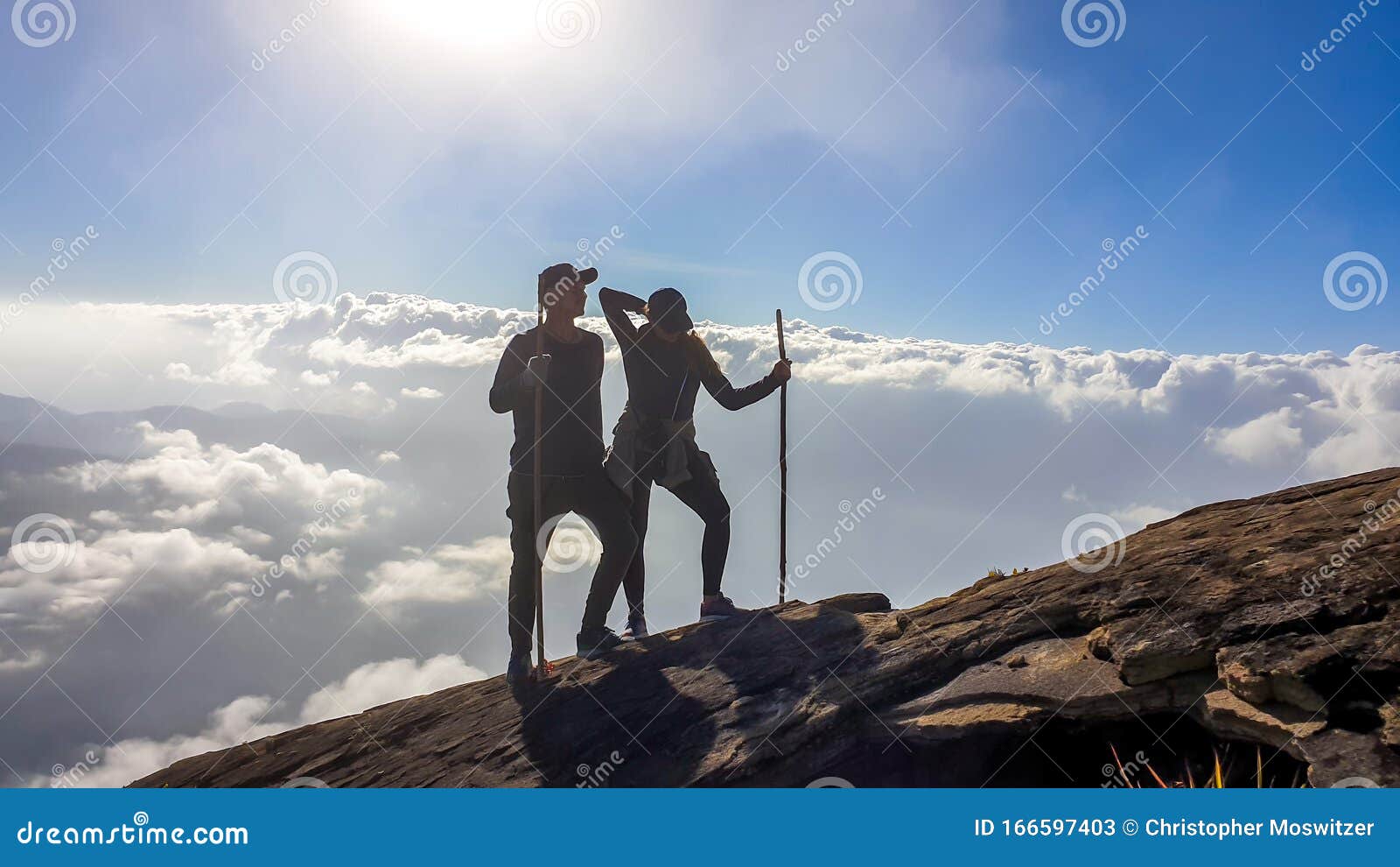 bajawa - a couple walking above the clouds