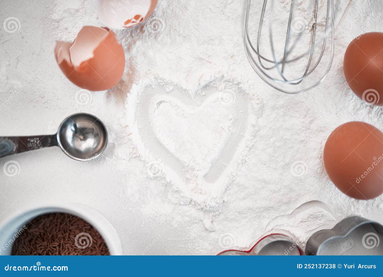 Bake with Love. Baking Powder Dusted into a Heart Shape on a Countertop
