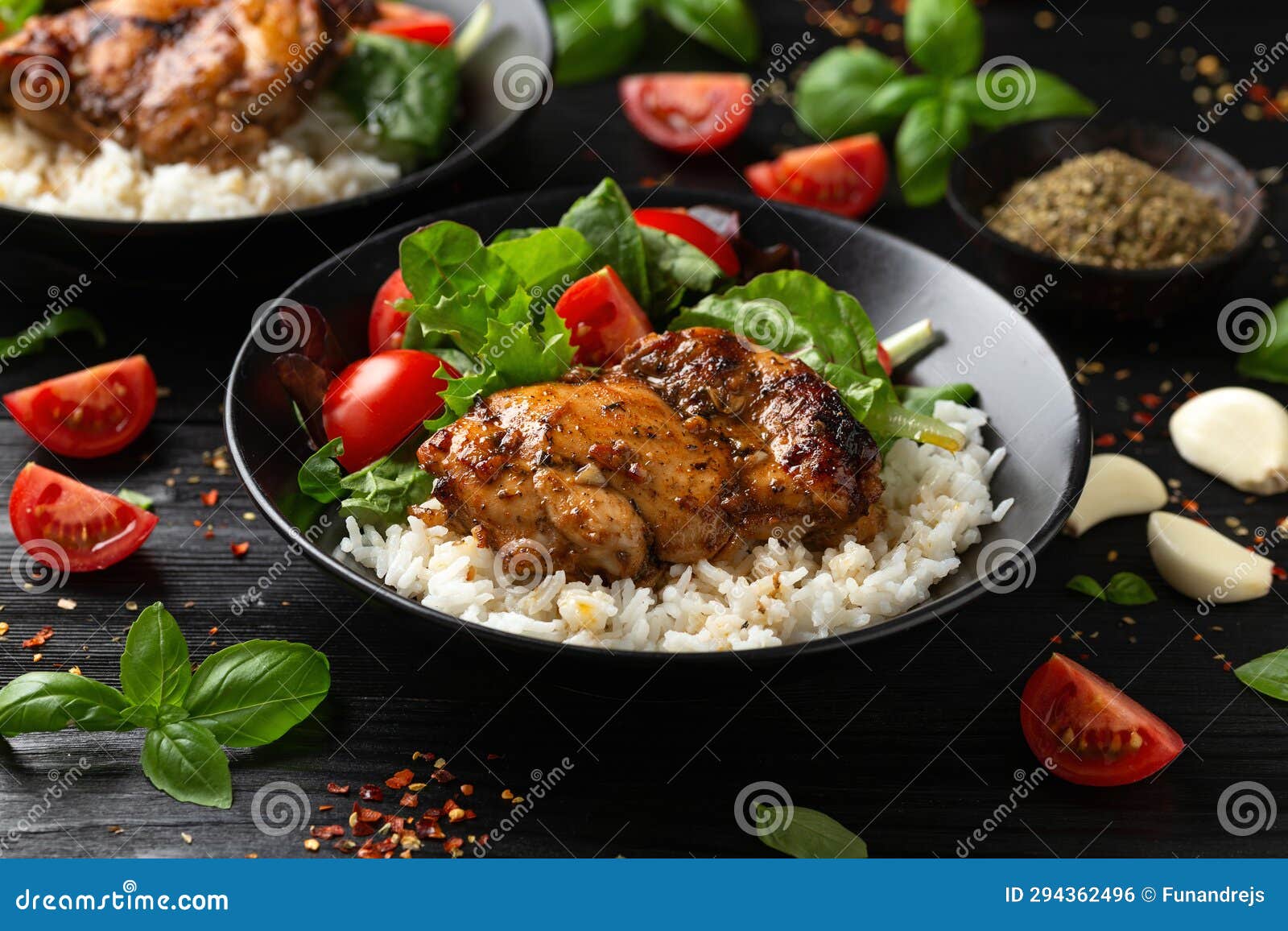 Baked Balsamic Chicken Thighs with Rice and Vegetables Stock Photo