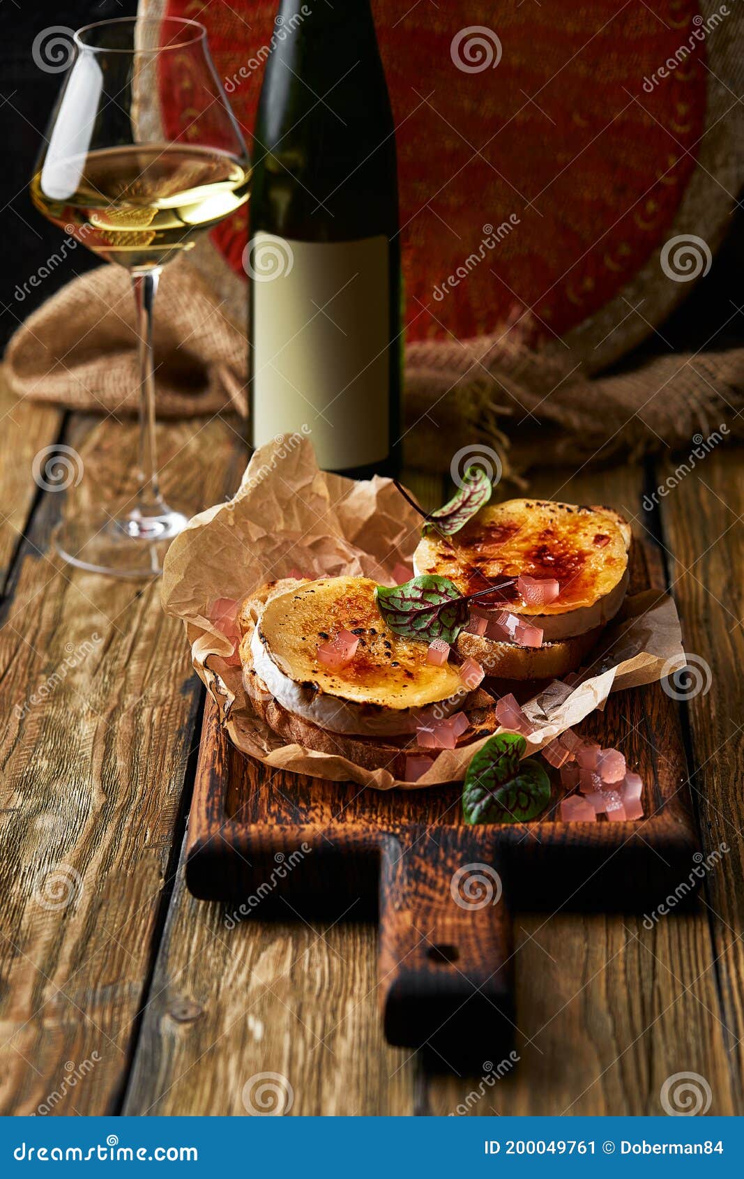 Baked Camembert Cheese with Toasted Bread on Wooden Board Stock Image