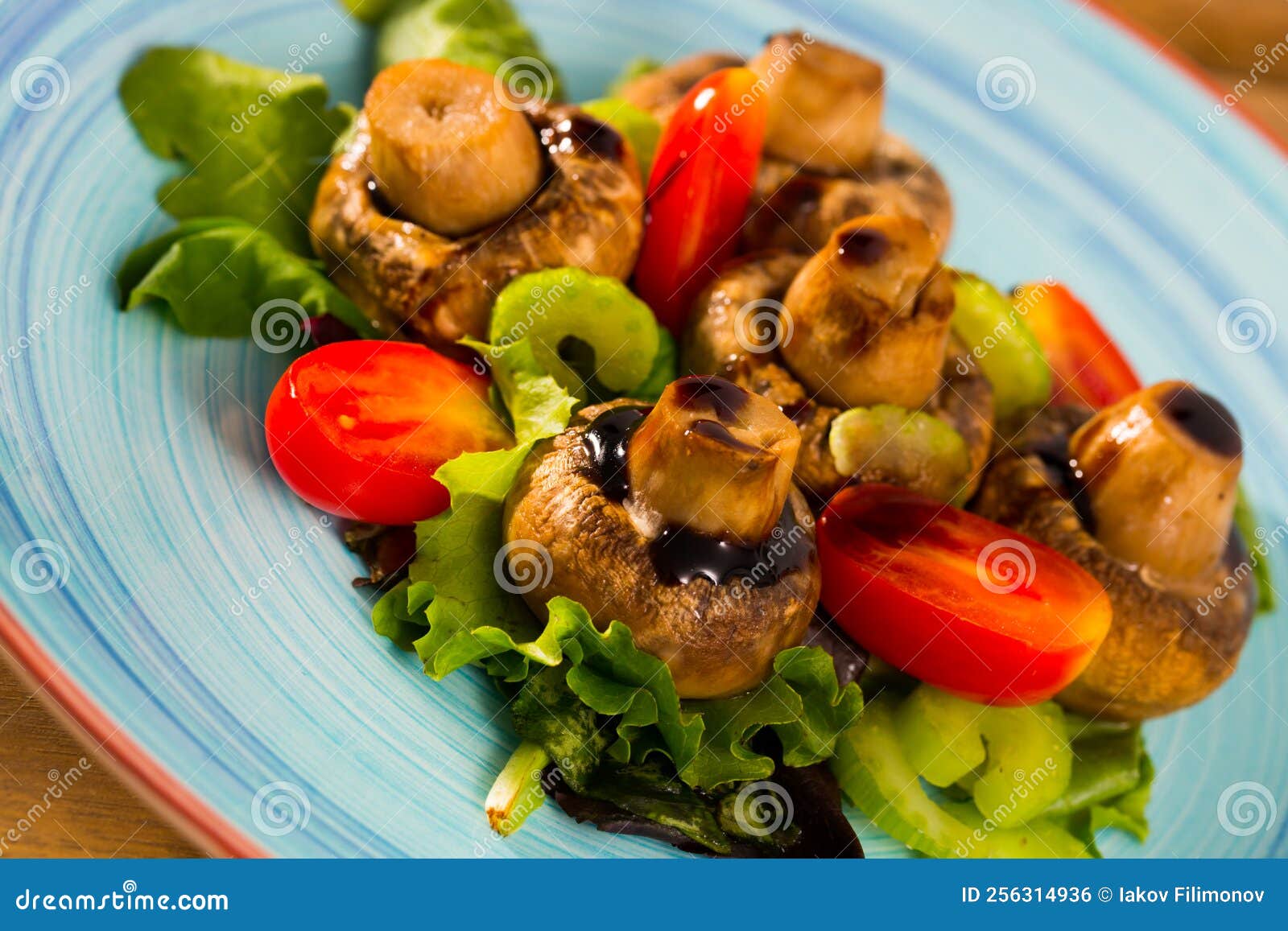 Baked Champignons with Spinach, Lettuce, Tomatoes, Celery Stock Photo