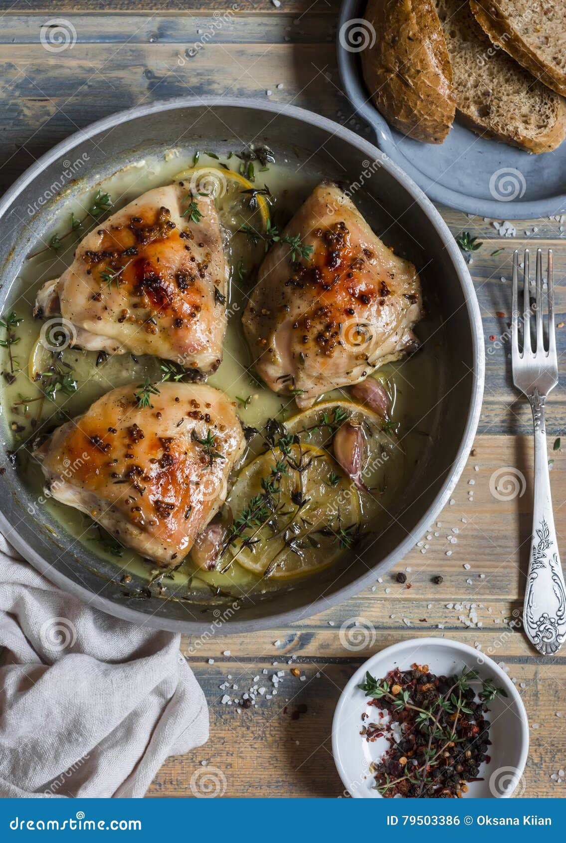 Baked Chicken in White Wine in the Pan. on Rustic Wooden Background