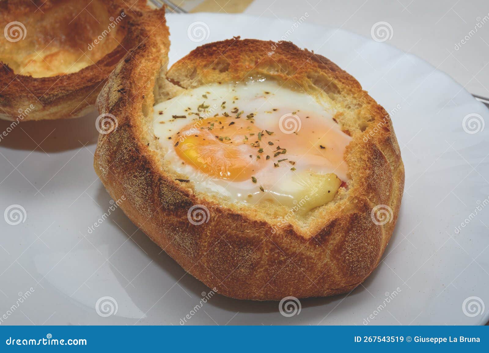 Baked Egg Cooked in Bread stock image. Image of meal - 267543519