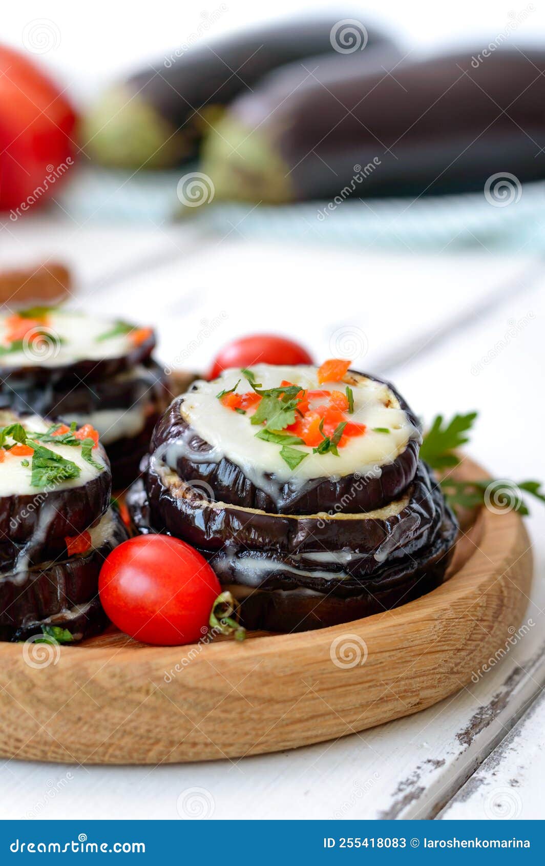Baked Eggplant, Tomatoes and Cheese on Table. Vertical View Stock Image