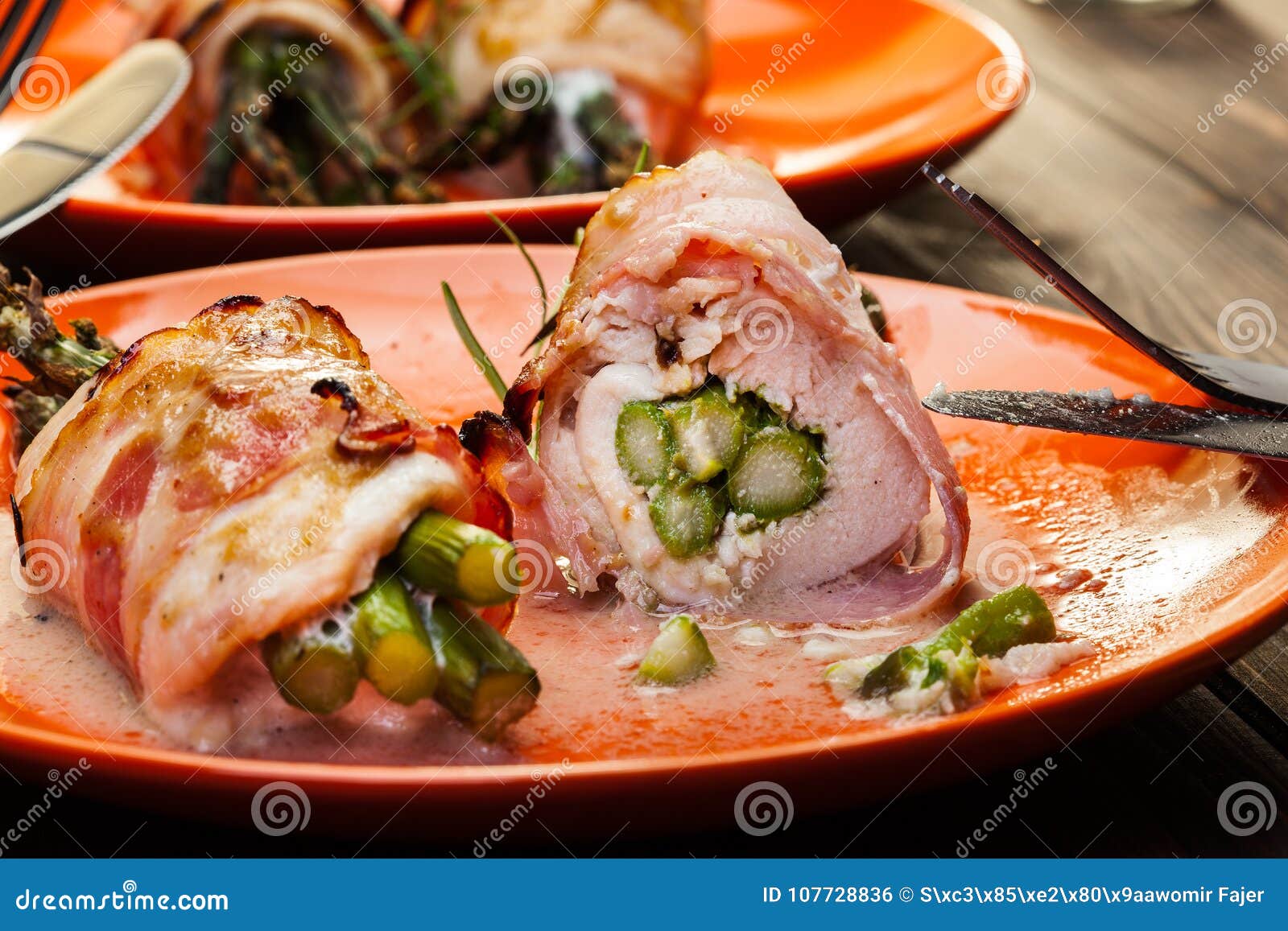 Baked Fresh Asparagus Wrapped in Chicken and Bacon Stock Photo Image