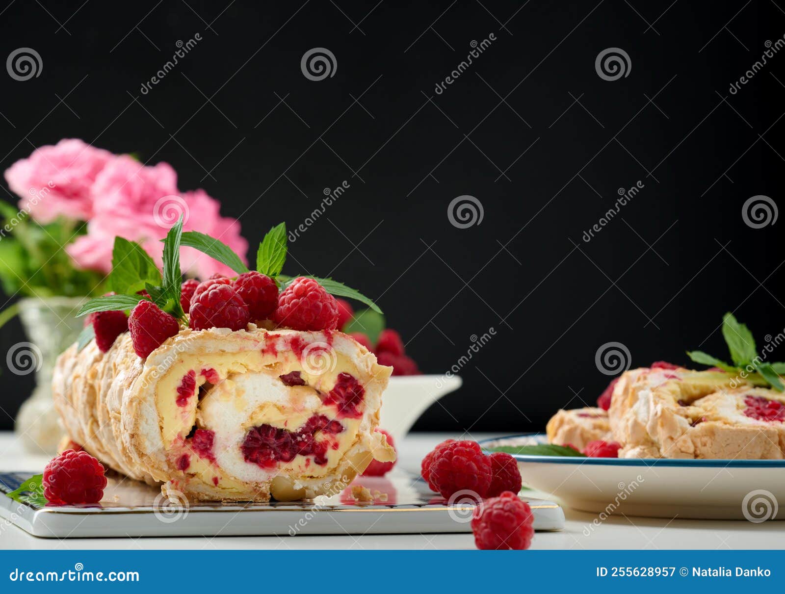 Baked Meringue Roll with Cream and Fresh Red Raspberry Stock Image