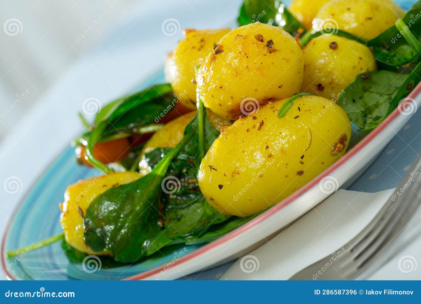 Baked New Potatoes with Spinach Stock Photo - Image of grilled