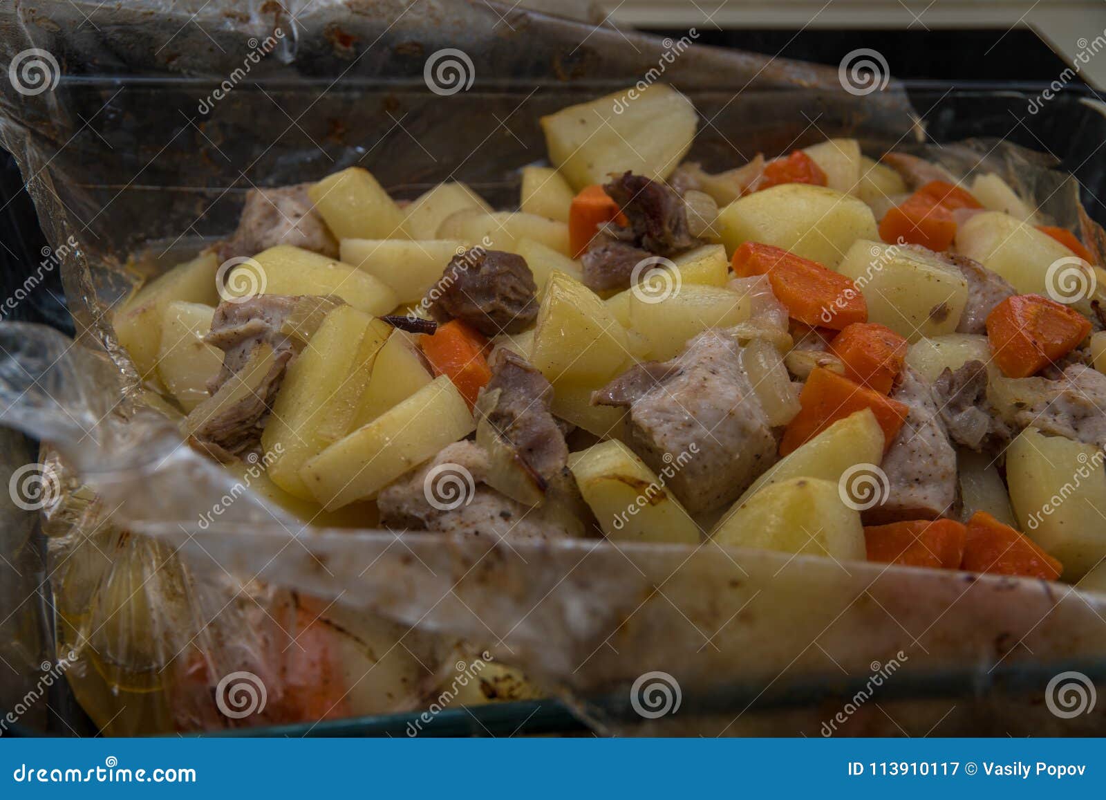 Baked in the Package Turkey Meat with Potatoes and Carrots Stock Image