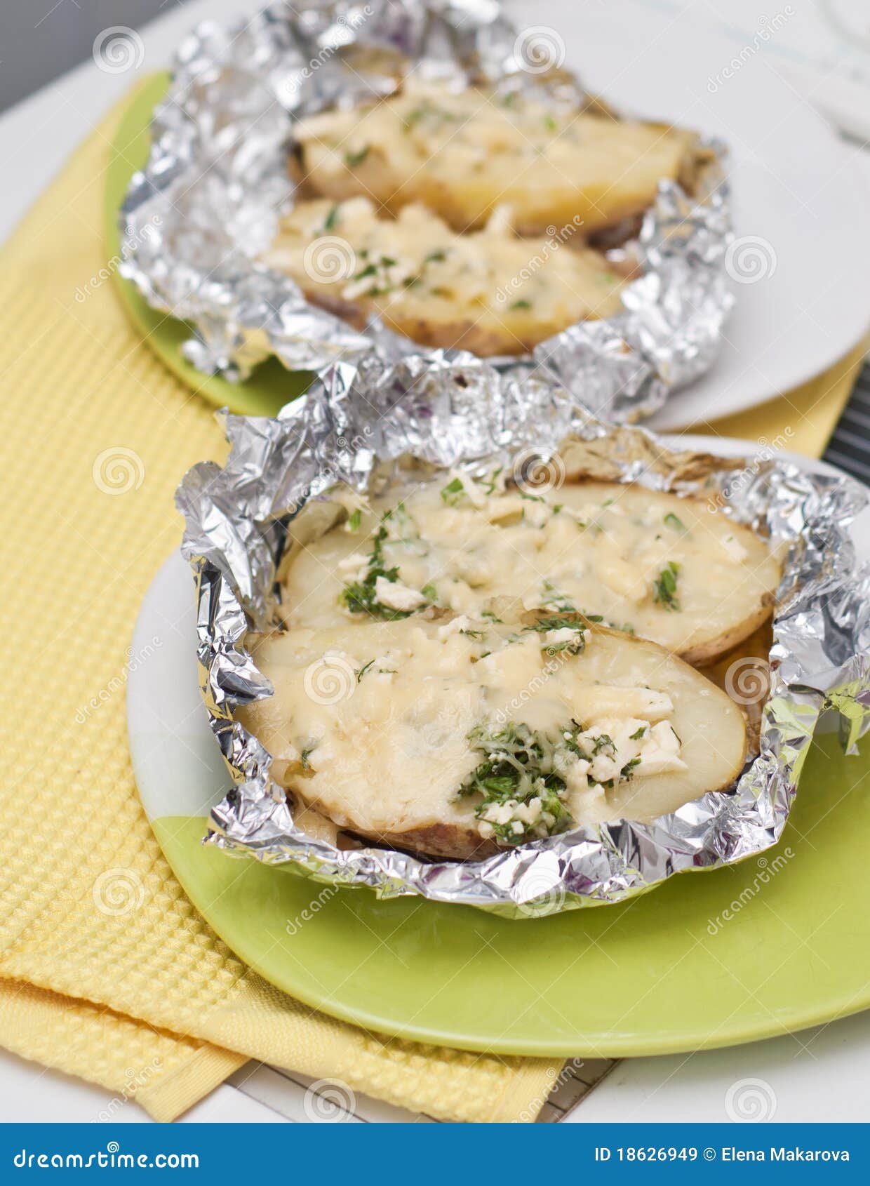 The baked potato in a foil stock image. Image of aluminum 18626949
