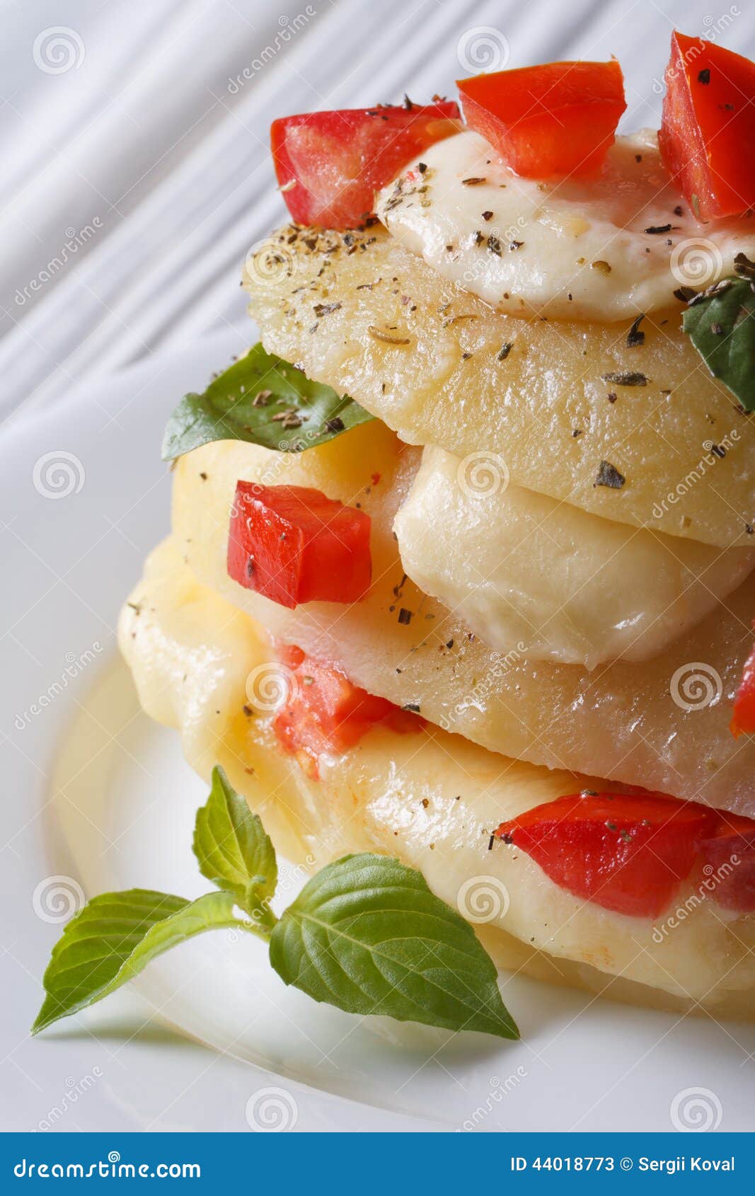 Baked Potato with Mozzarella, Tomato and Basil Macro Vertical Stock