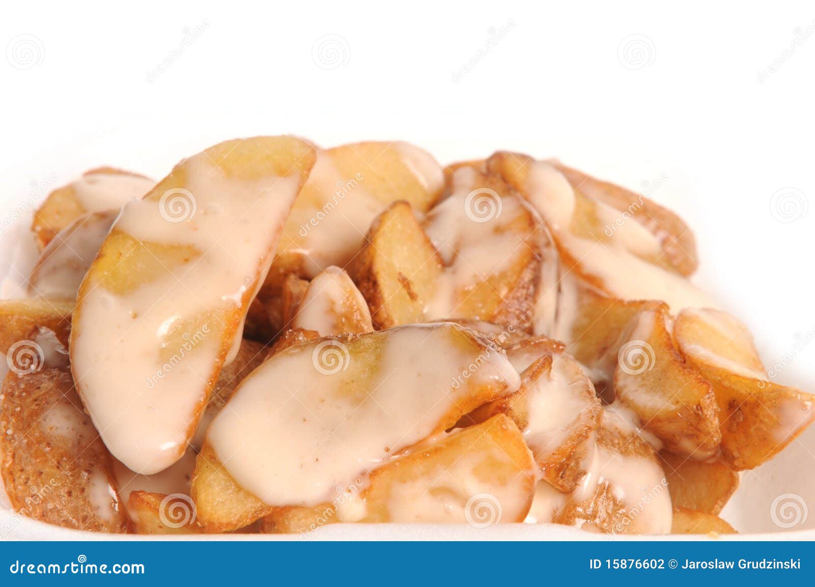 Baked potatoes with sauce stock photo. Image of cooked 15876602