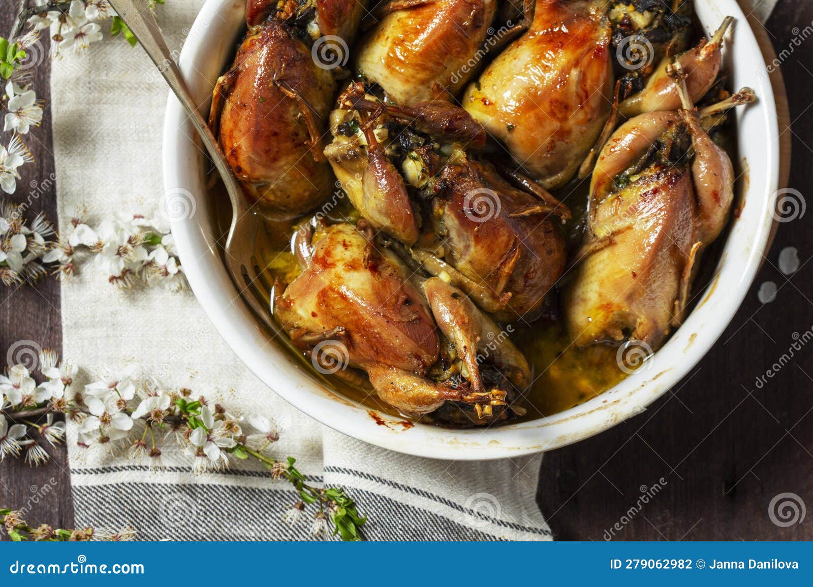 Baked Quail Stuffed with Mushrooms, Eggs and Bread in a Ceramic Form on