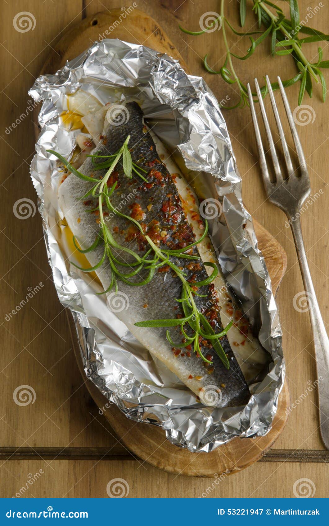 Baked sea bass stock image. Image of dinner, rosemary - 53221947