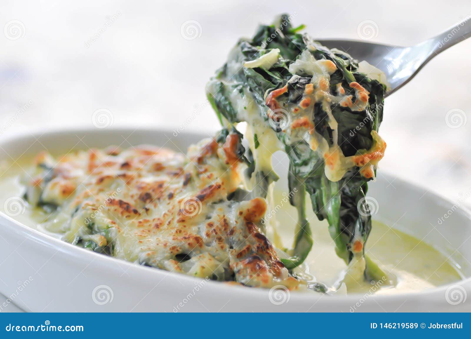 Baked spinach with cheese stock image. Image of vegetable - 146219589