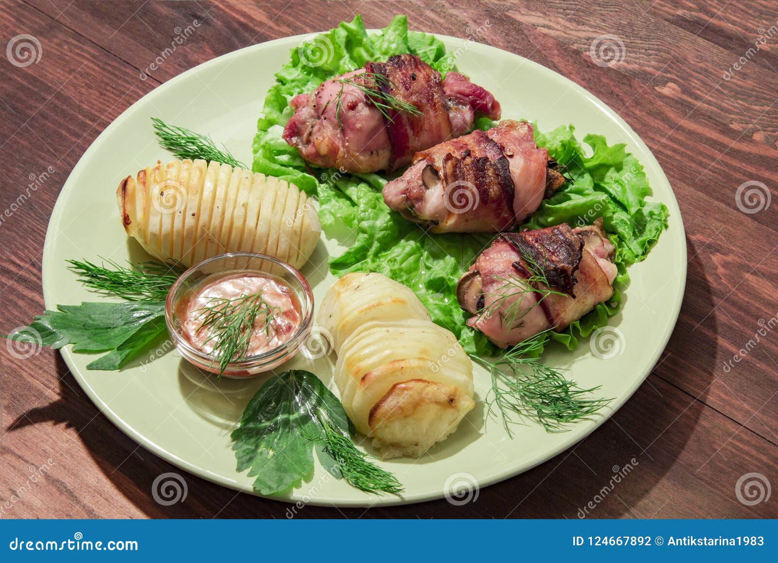 Baked Stuffed Chicken Thighs with Potatoes and Mushrooms Stock Photo