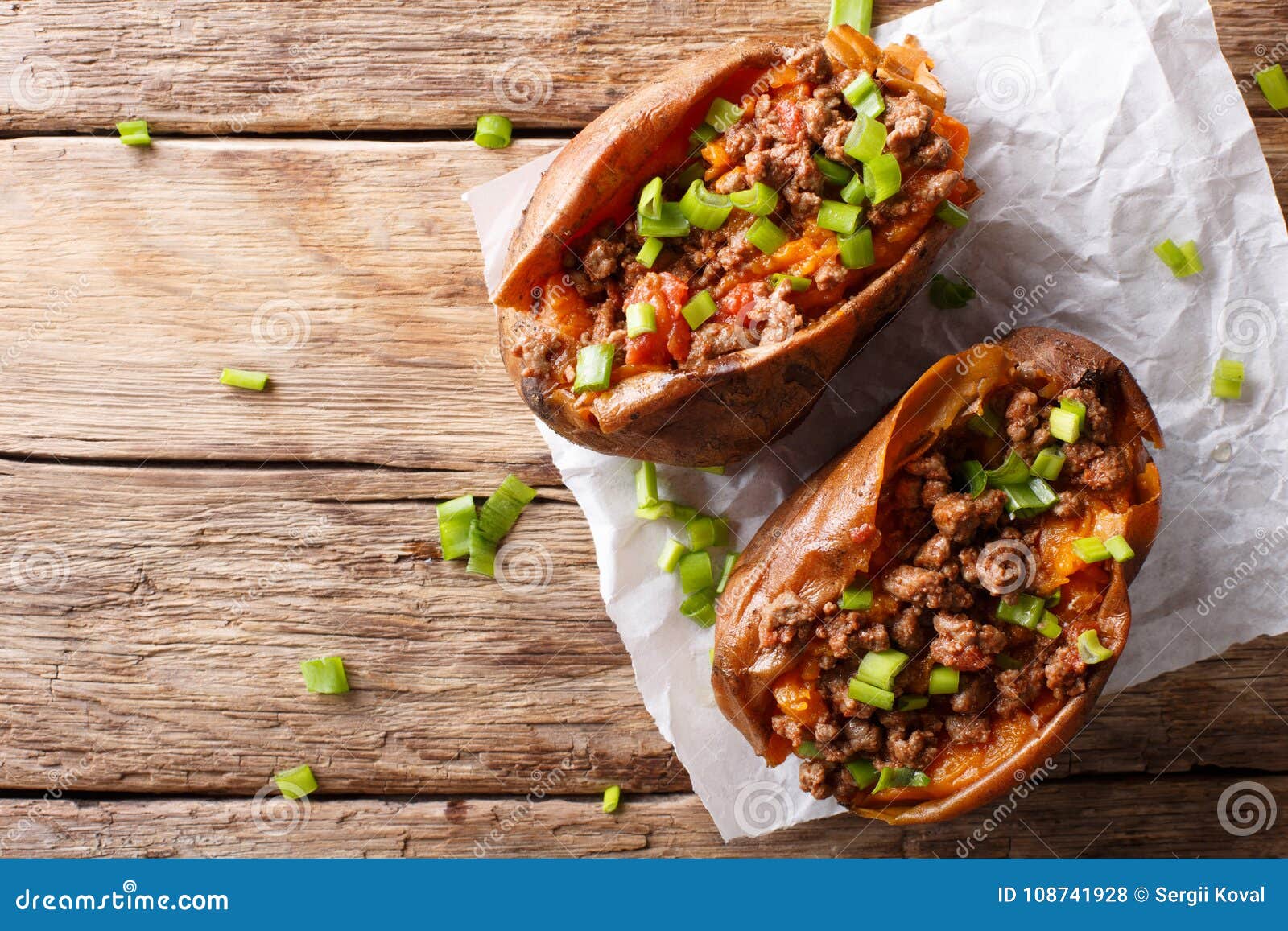 Baked Sweet Potatoes Stuffed with Ground Beef with Tomatoes and Stock