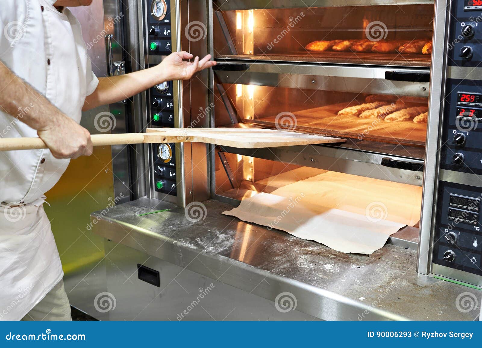 Baker bakes bread in oven stock image. Image of commercial 90006293