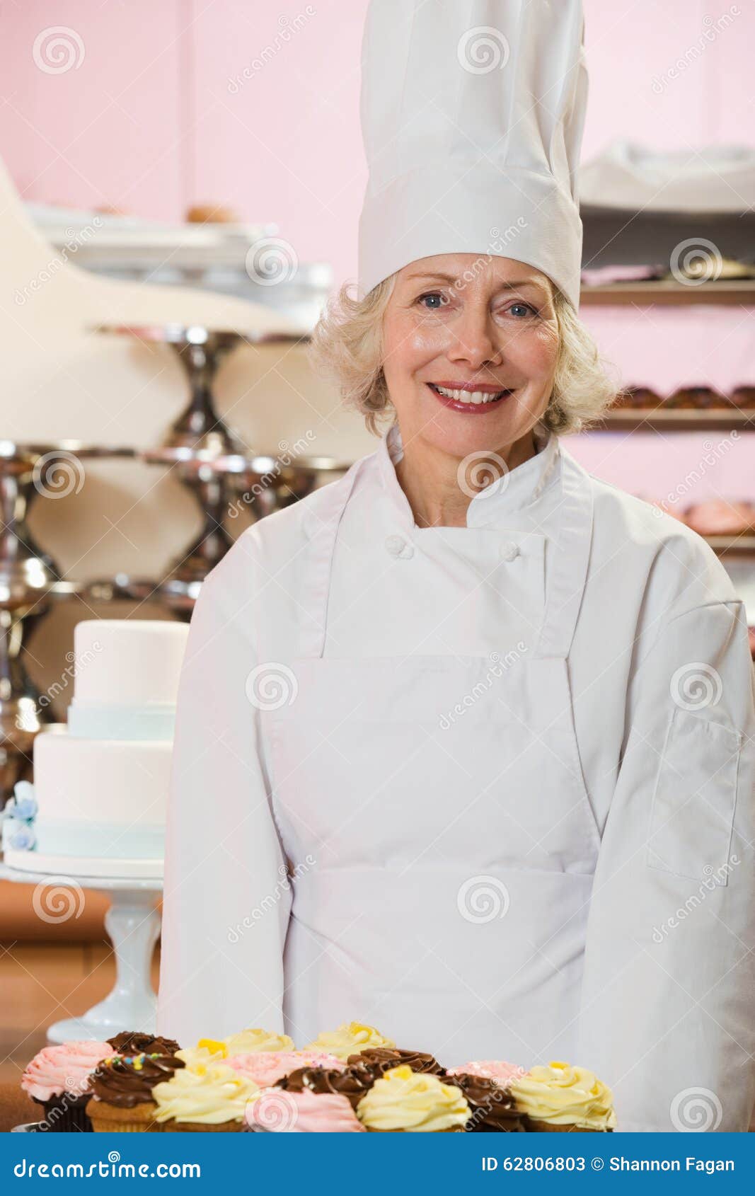 Baker with cakes stock image. Image of business, dessert 62806803