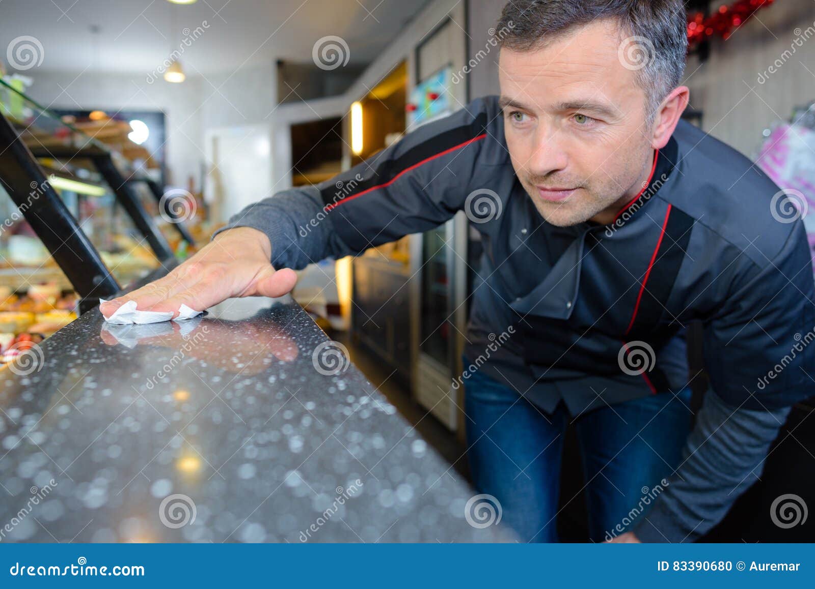 Baker cleaning showcase stock photo. Image of clean, wipe 83390680