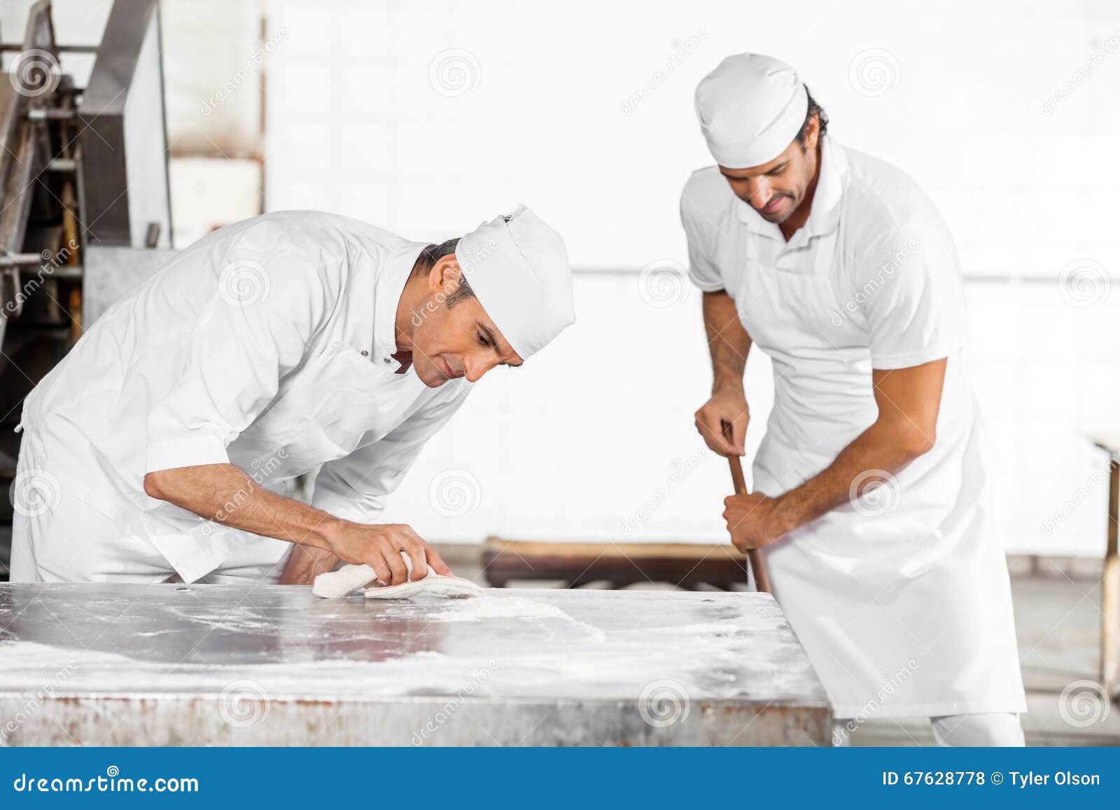 Baker Cleaning Table while Colleague Using Mop Stock Photo Image of