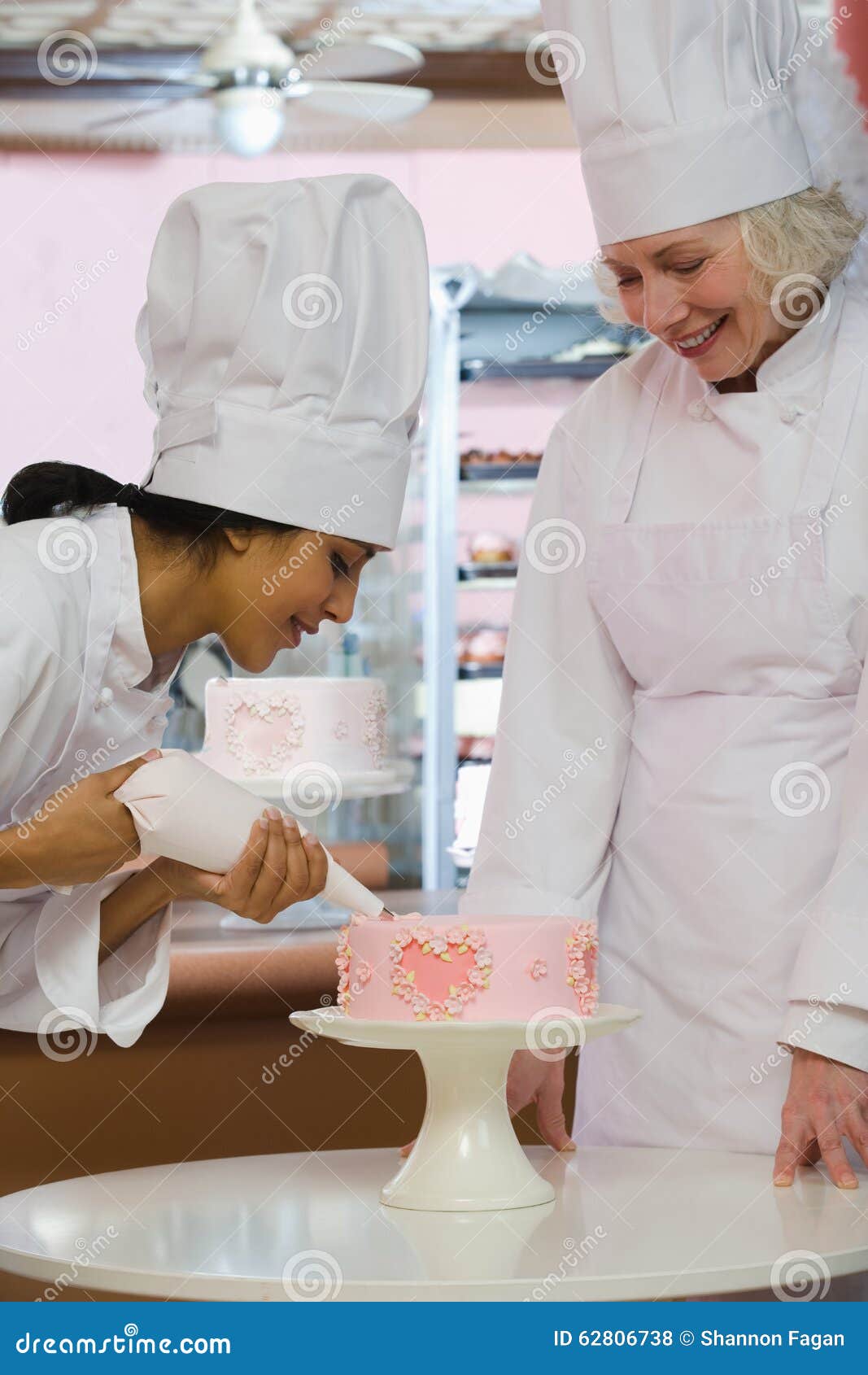 Baker decorating cake stock photo. Image of heart, decorating 62806738