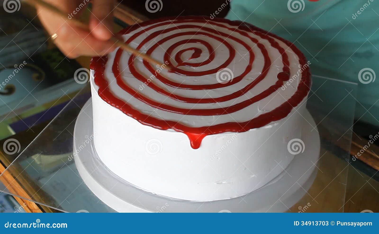 Baker Decorating Vanilla Cake with Strawberry Sauce Stock Footage ...