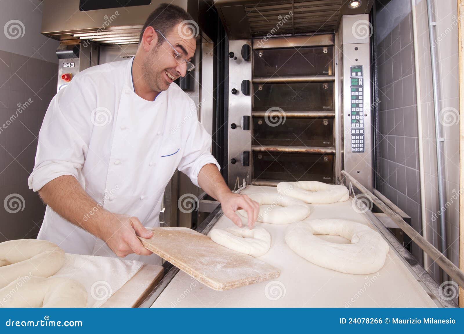 Baker makes the bread stock photo. Image of food, oven 24078266