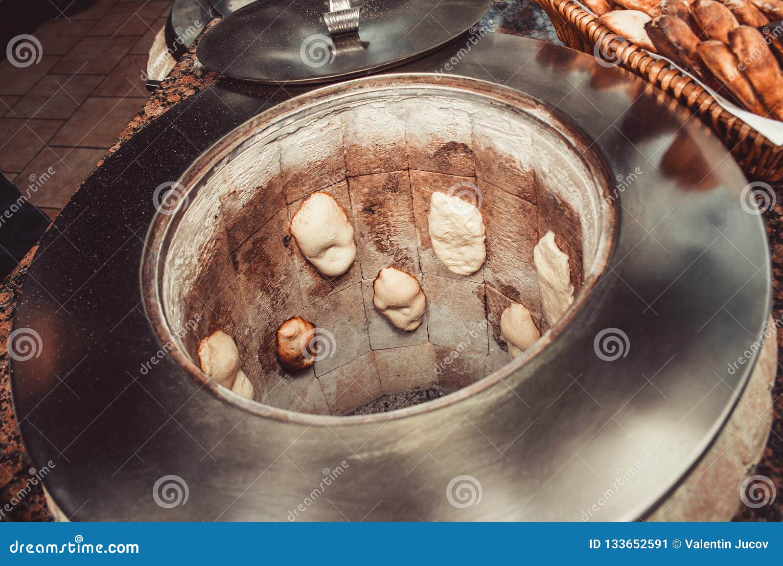 Baker Making Turkish Pita Bread in Tandoor, Clay Oven. Baking Process. Many  Fresh Hot Bread in the Basket. Stock Photo - Image of basket, bread:  133652622
