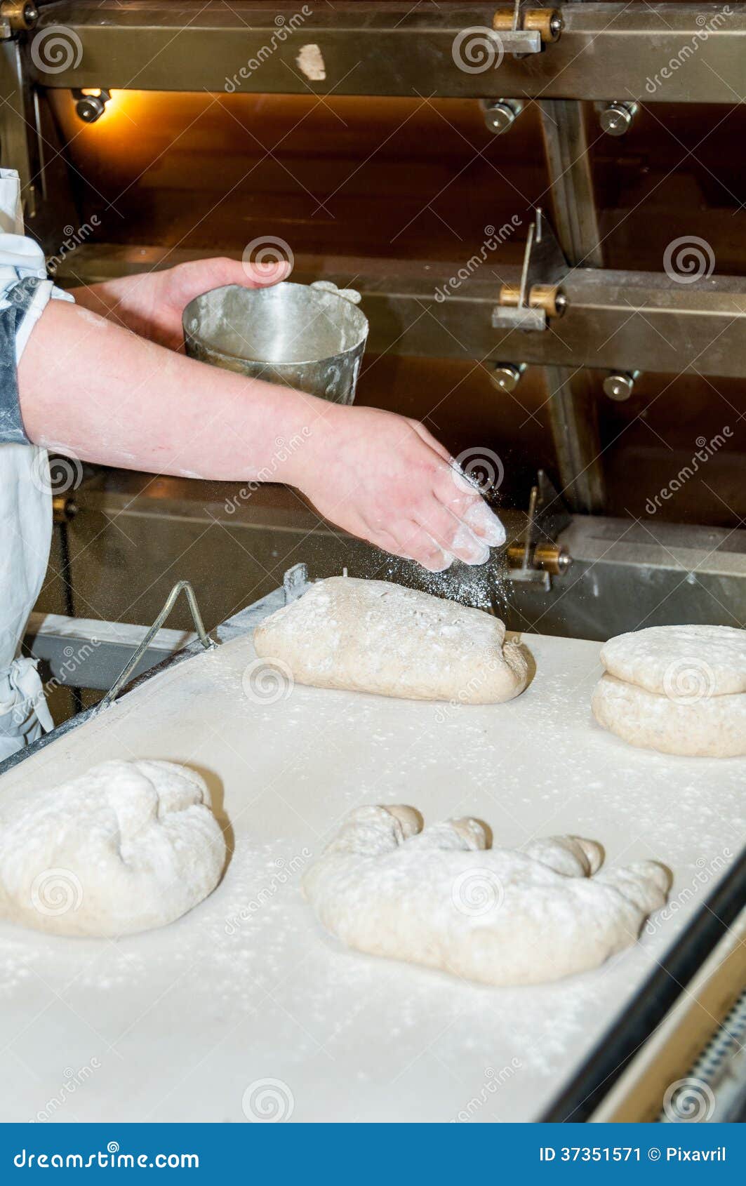 Baker preparing bread before baking