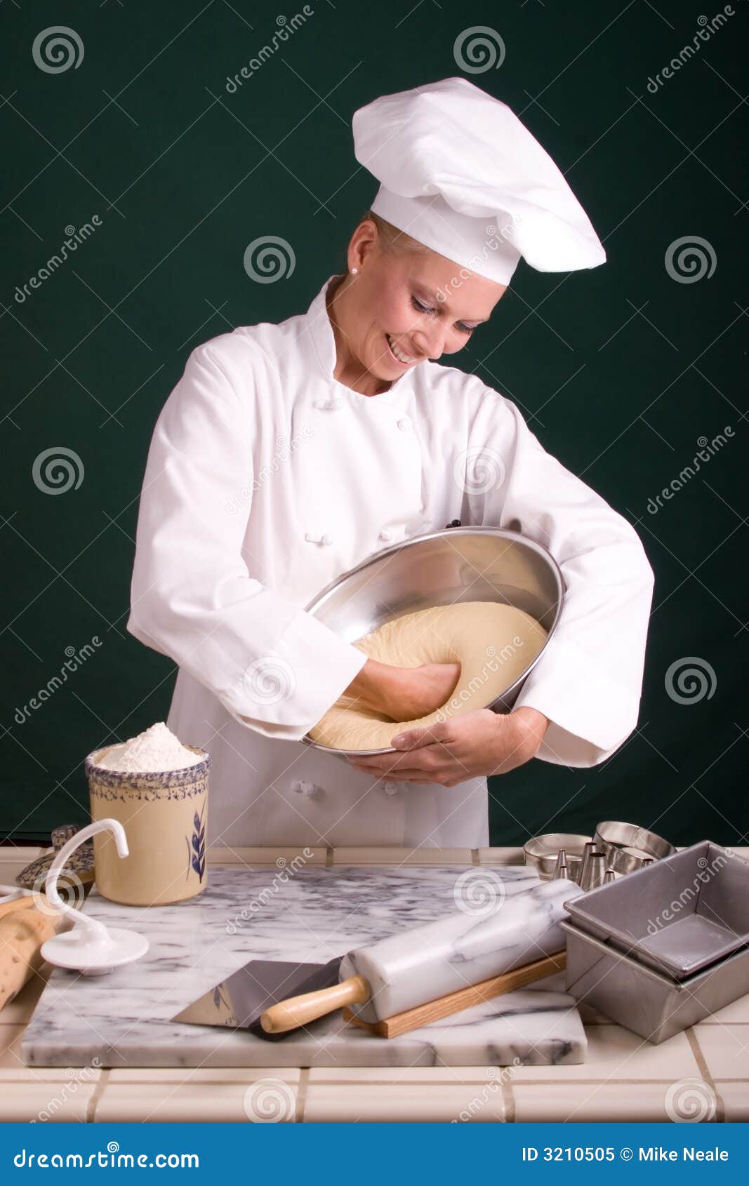 Baker punching dough stock image. Image of attractive 3210505