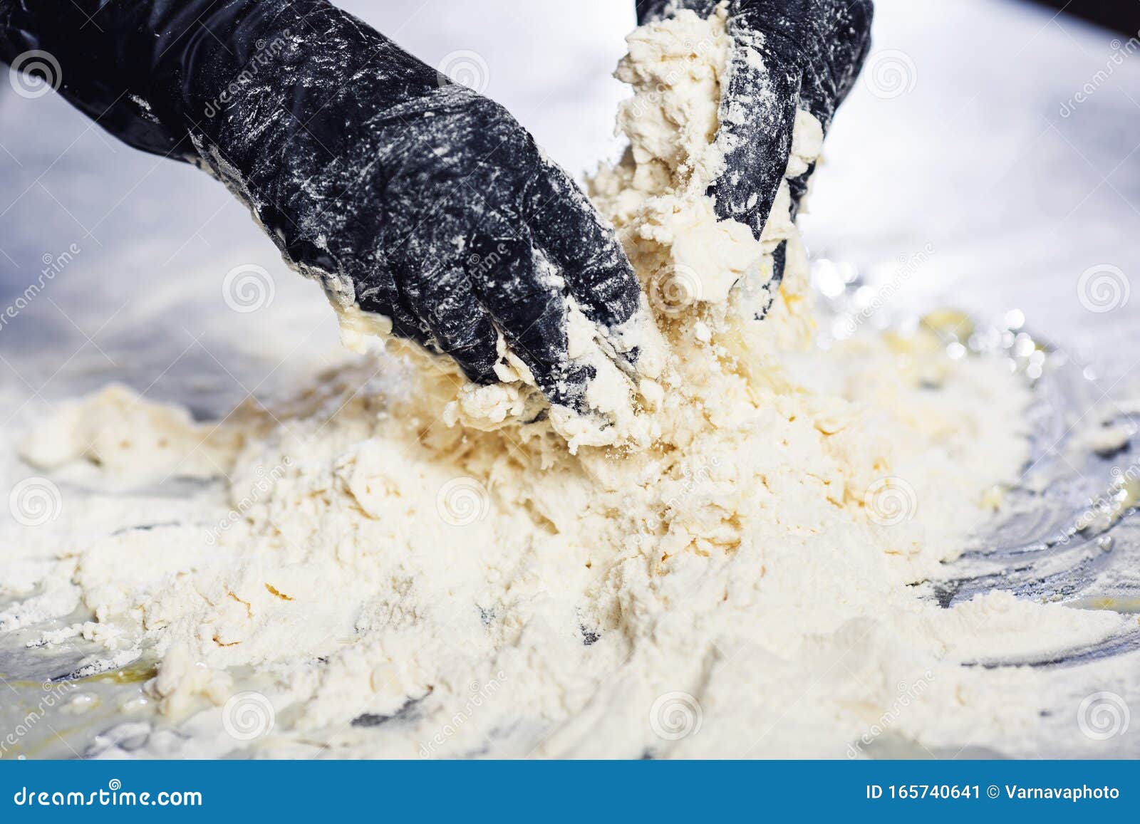Baker`s Hands in Black Gloves Knead the Dough Stock Image Image of
