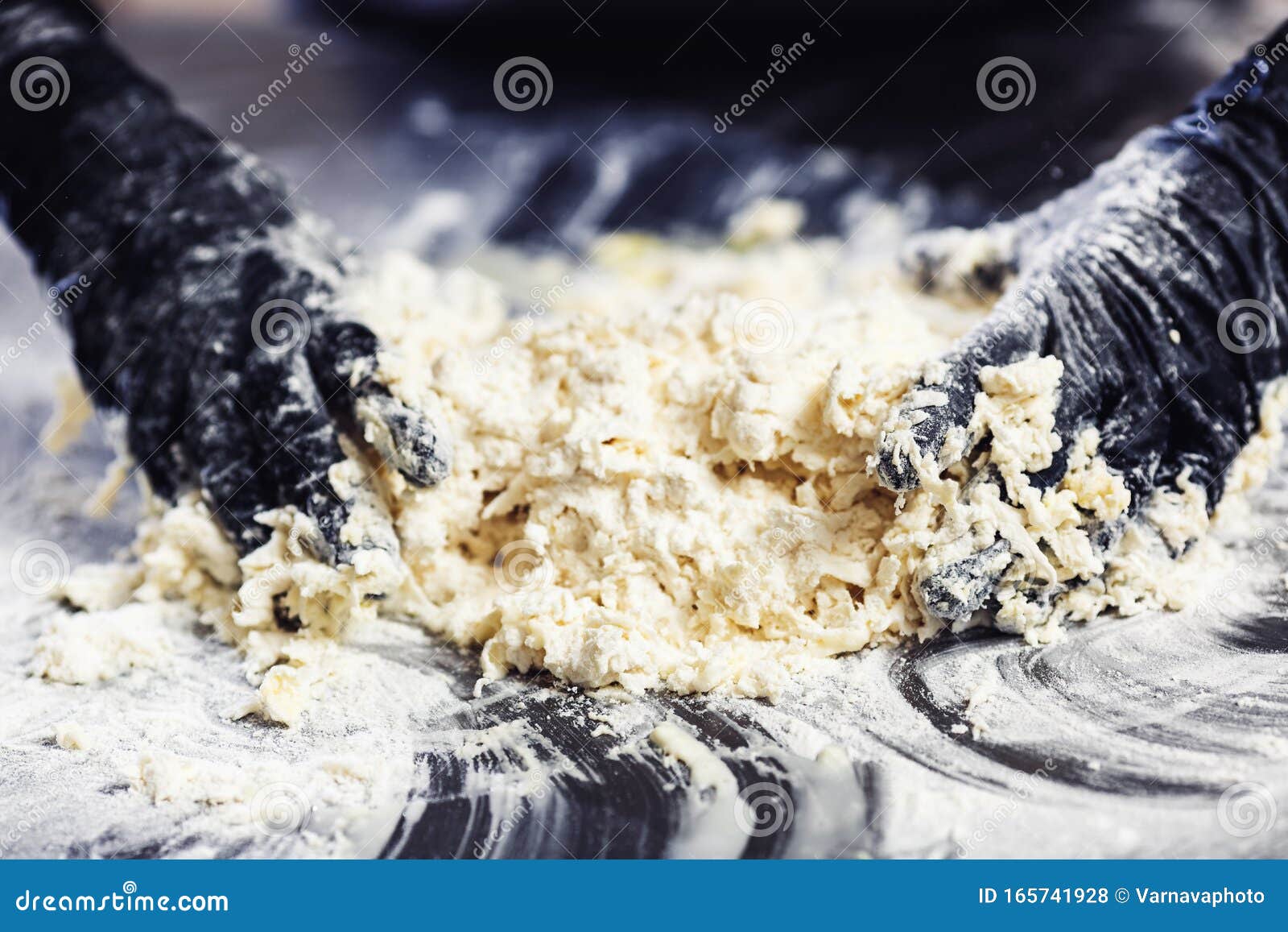 Baker`s Hands in Black Gloves Knead the Dough Stock Photo Image of