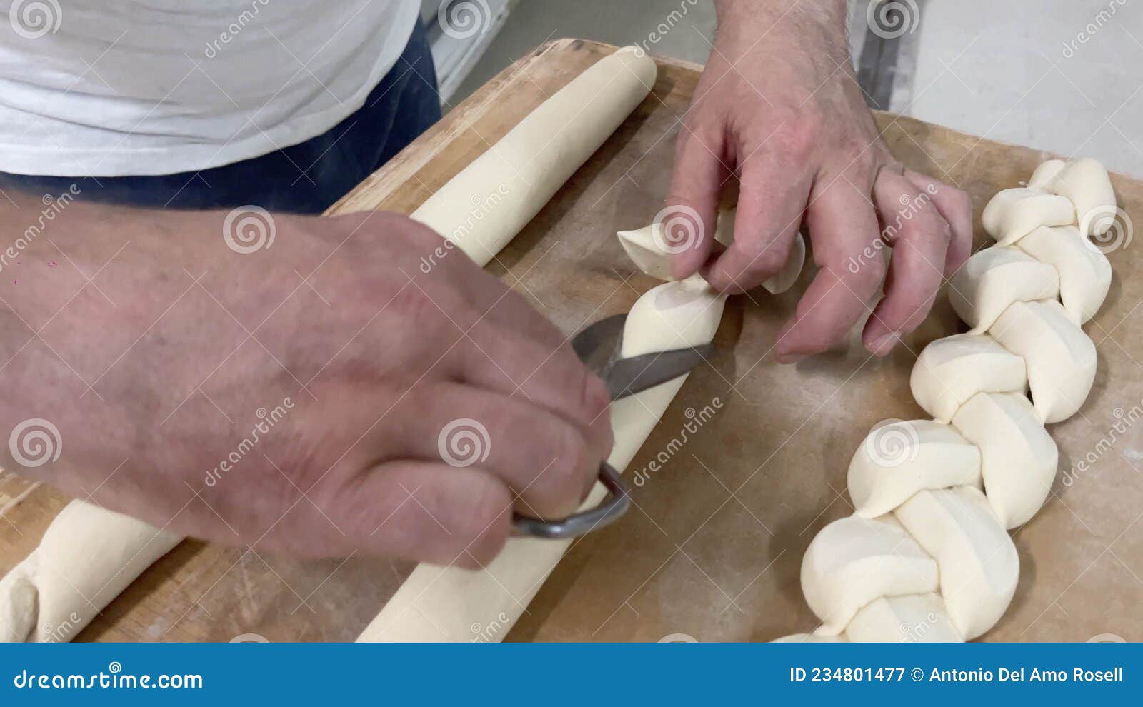 baker's hands ing bread.