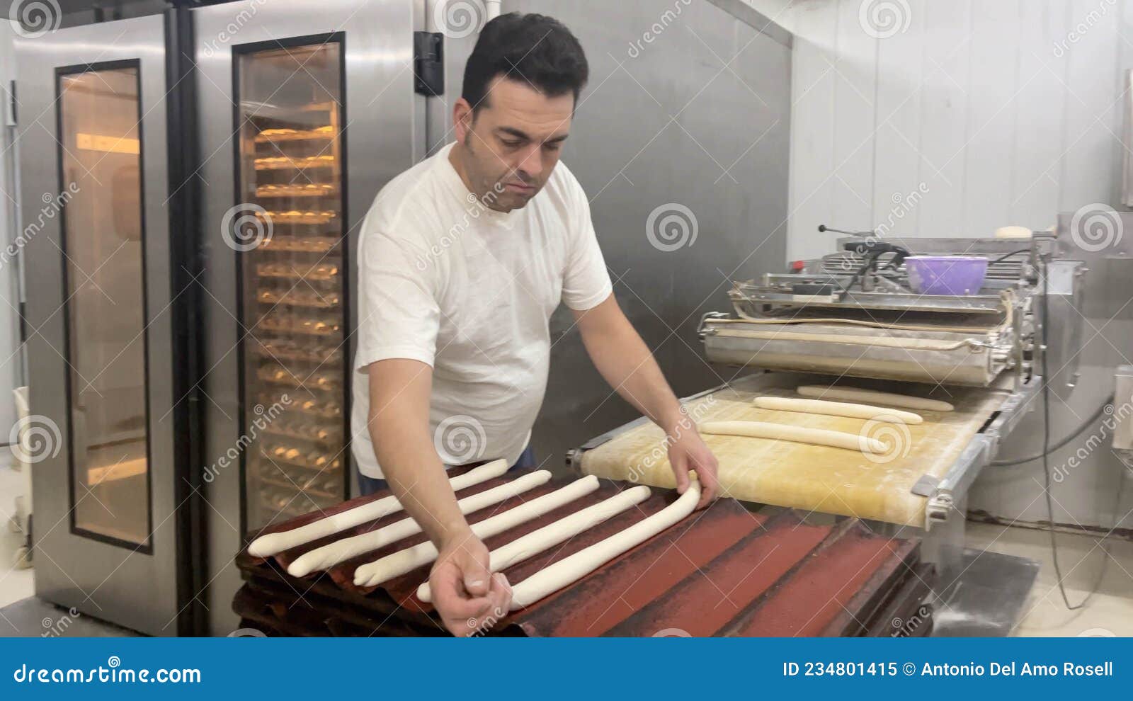 baker working in industrial bakery