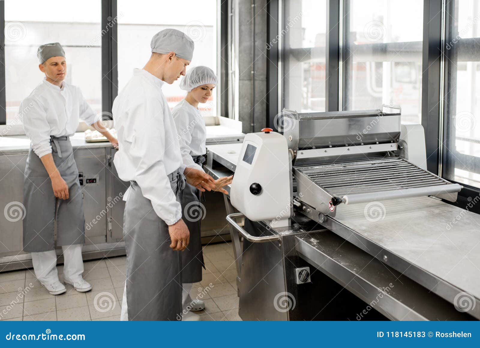 Bakers Rolling Dough at the Manufacturing Stock Image Image of baking
