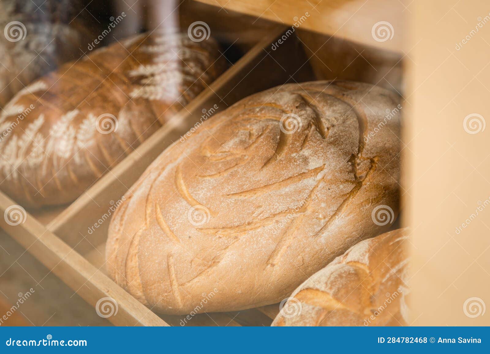 Bakery Window with Fresh Bread, View from the Street. Stock Photo