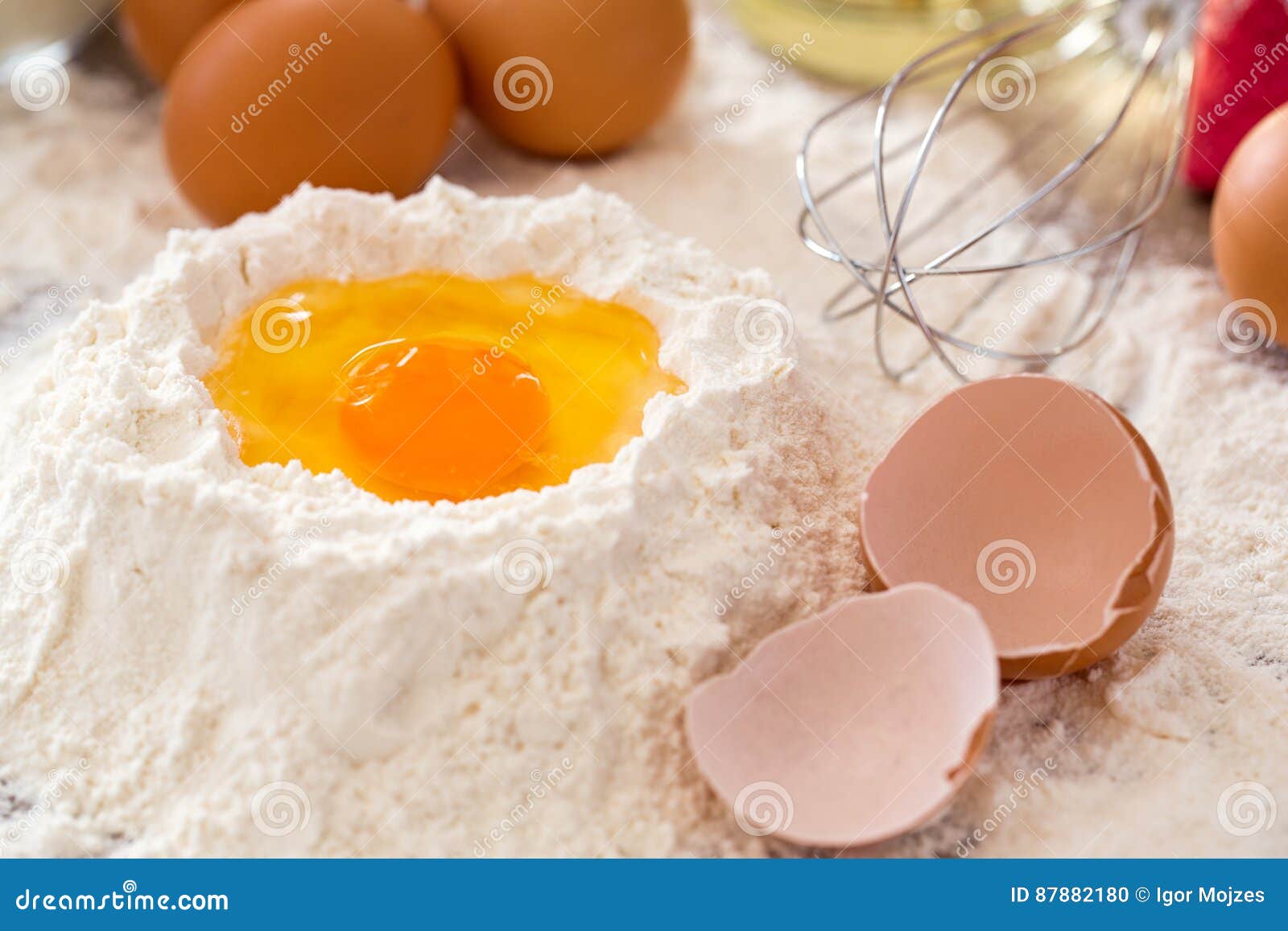 Baking Ingredients mixing Egg And Flour Baking Cakes Stock Photo