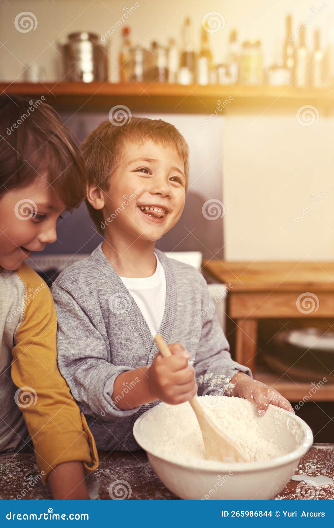 Baking with a Smile. Two Young Brothers Baking in the Kitchen. Stock