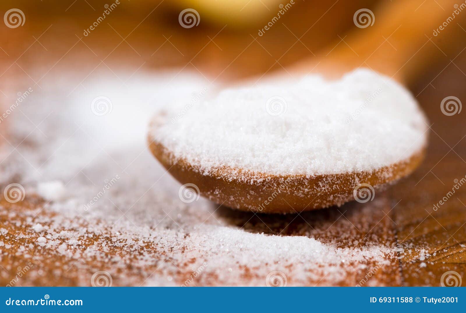 baking soda (sodium bicarbonate) in a wooden spoon