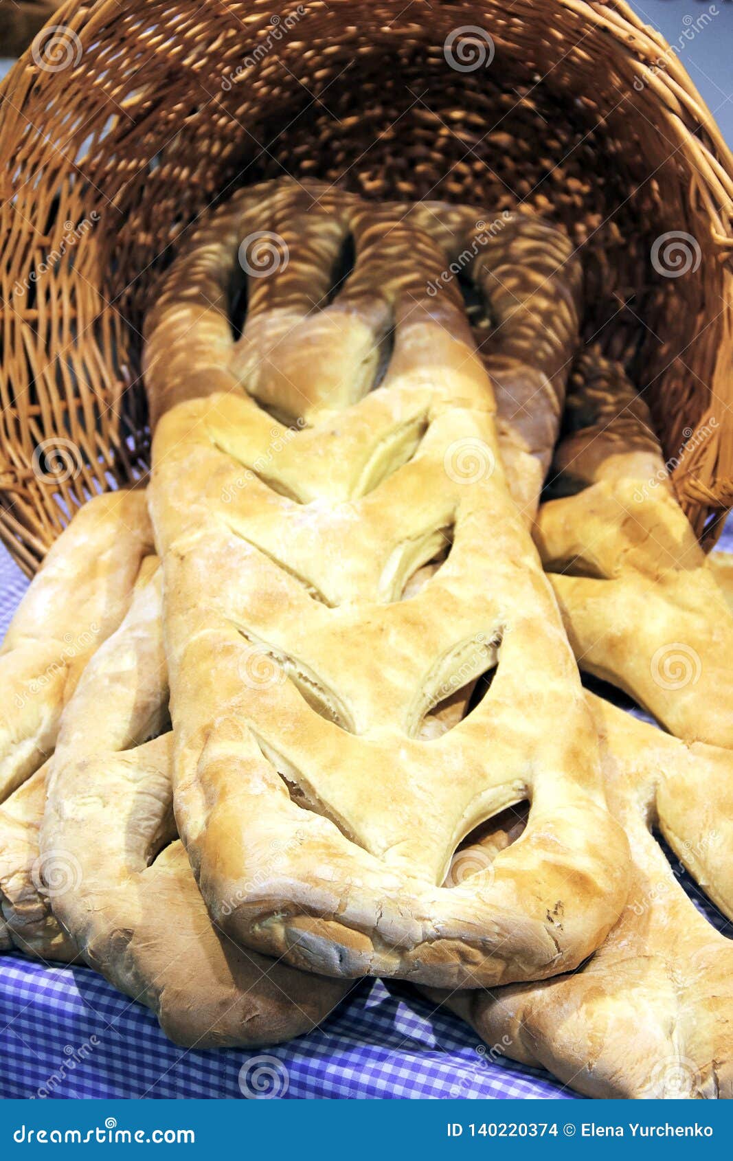 Baking Theme Image with a Wicker Basket Full of Homemade Bread. Stock