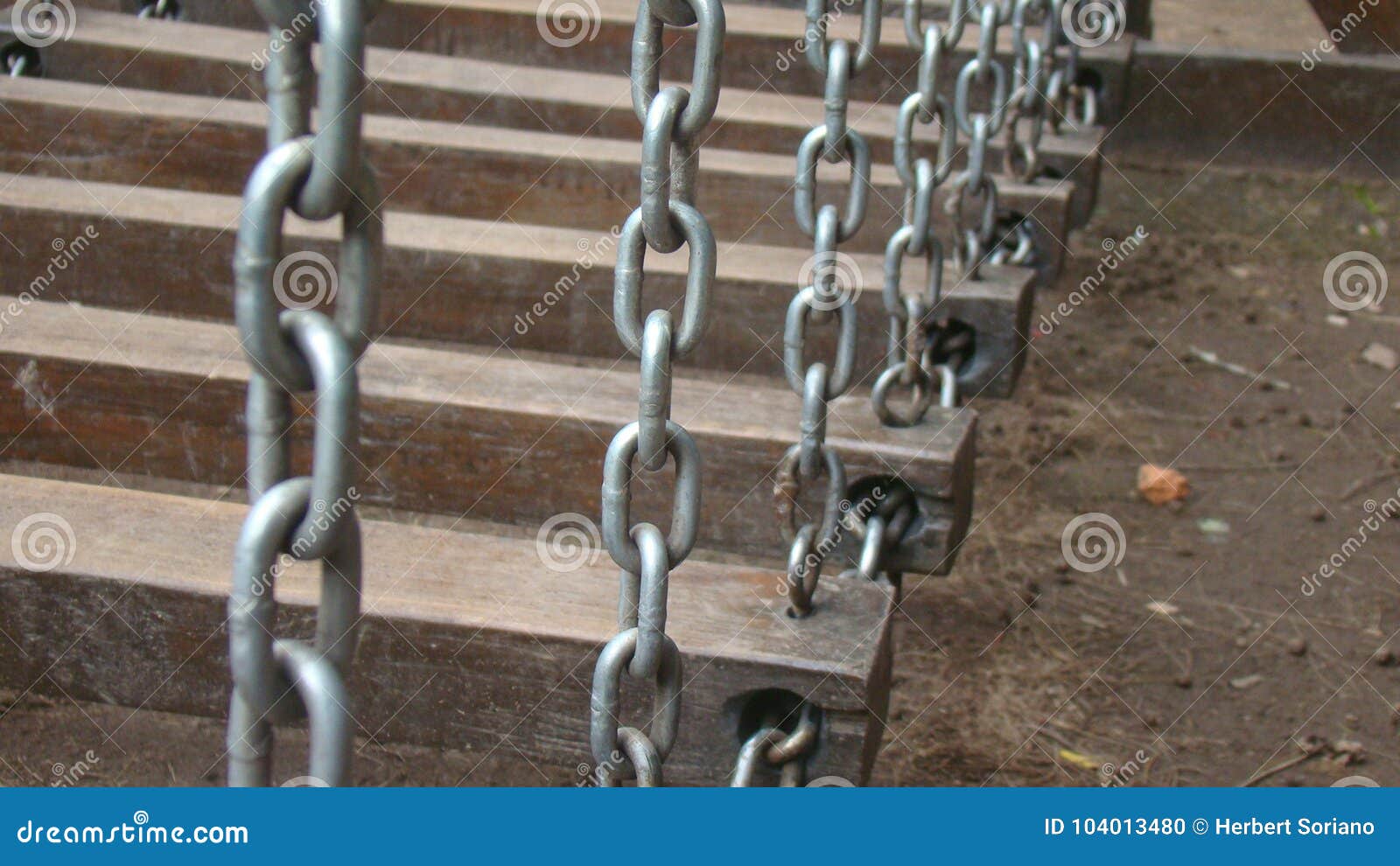 children game in a park made of good and iron chains