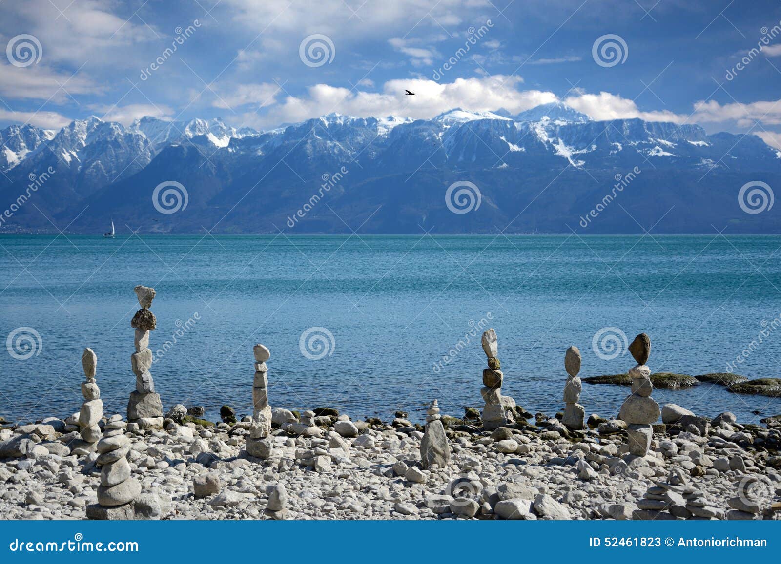 Stones balance on the lake with views of the mountains. Stones balance on the lake with beautiful views of the mountains