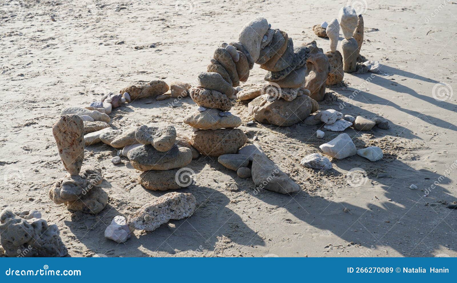 Balancing Stones on Sand. Zen Style Stones by the Sea Stock Image