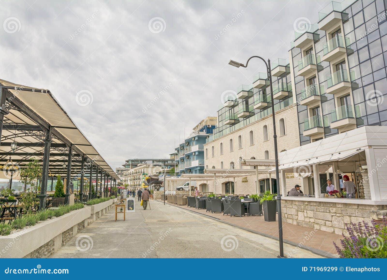 Balchik ,seaside resort in Bulgaria. Moody day on the shore of the Balchik, seaside resort and romantic coastal town at the Black Sea ,Bulgaria. Restaurants and terrace on the sea shore.