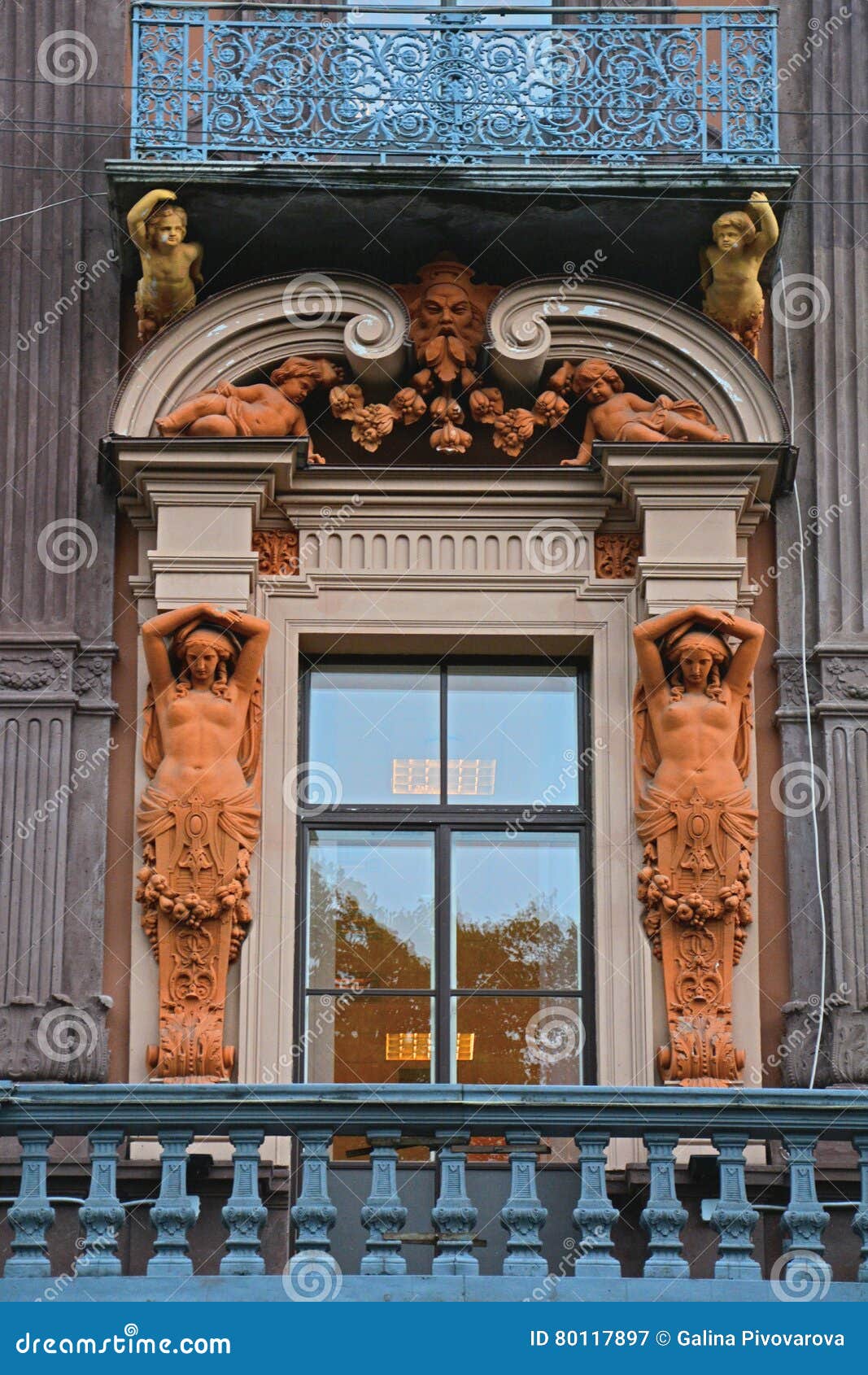 balcon with statues of house of the merchant utin in saint petersburg, russia