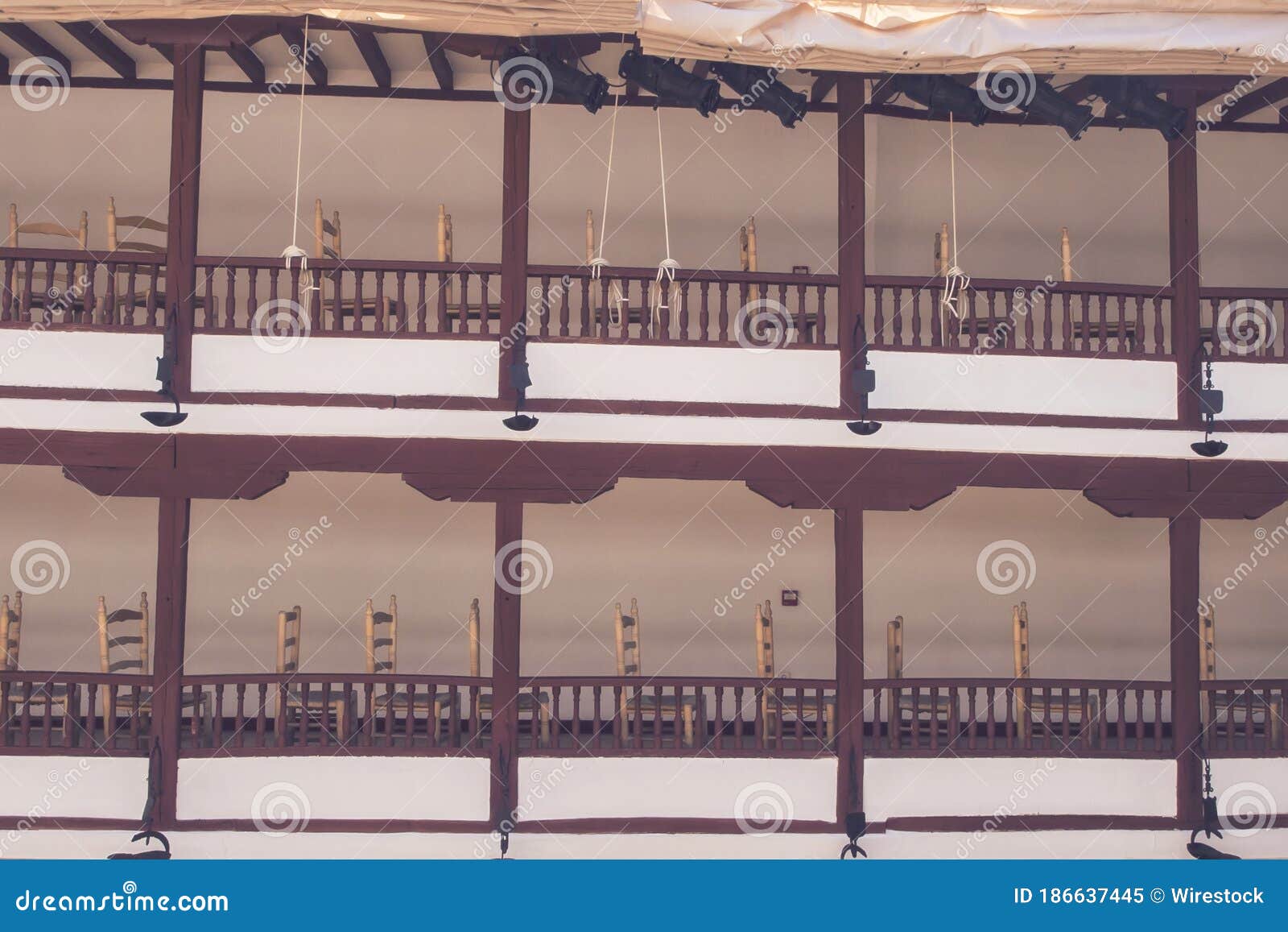 balconies with wooden chairs in corral de comedias ancient theater captured in almagro, spain