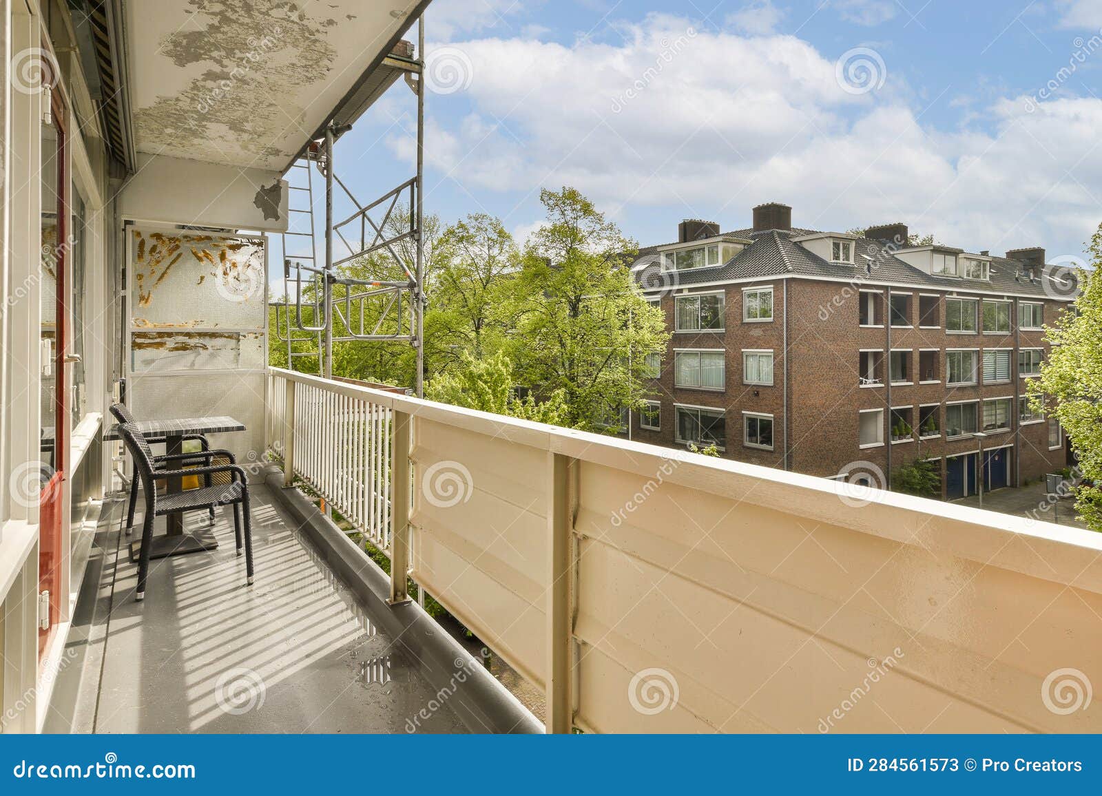 The Balcony of a Condo with Chairs and a Table Stock Image Image of