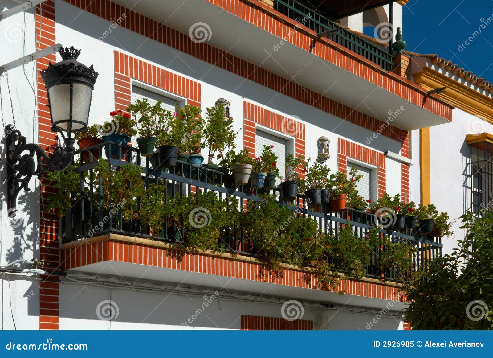 Balcony with flowers stock image. Image of lamp, window 2926985