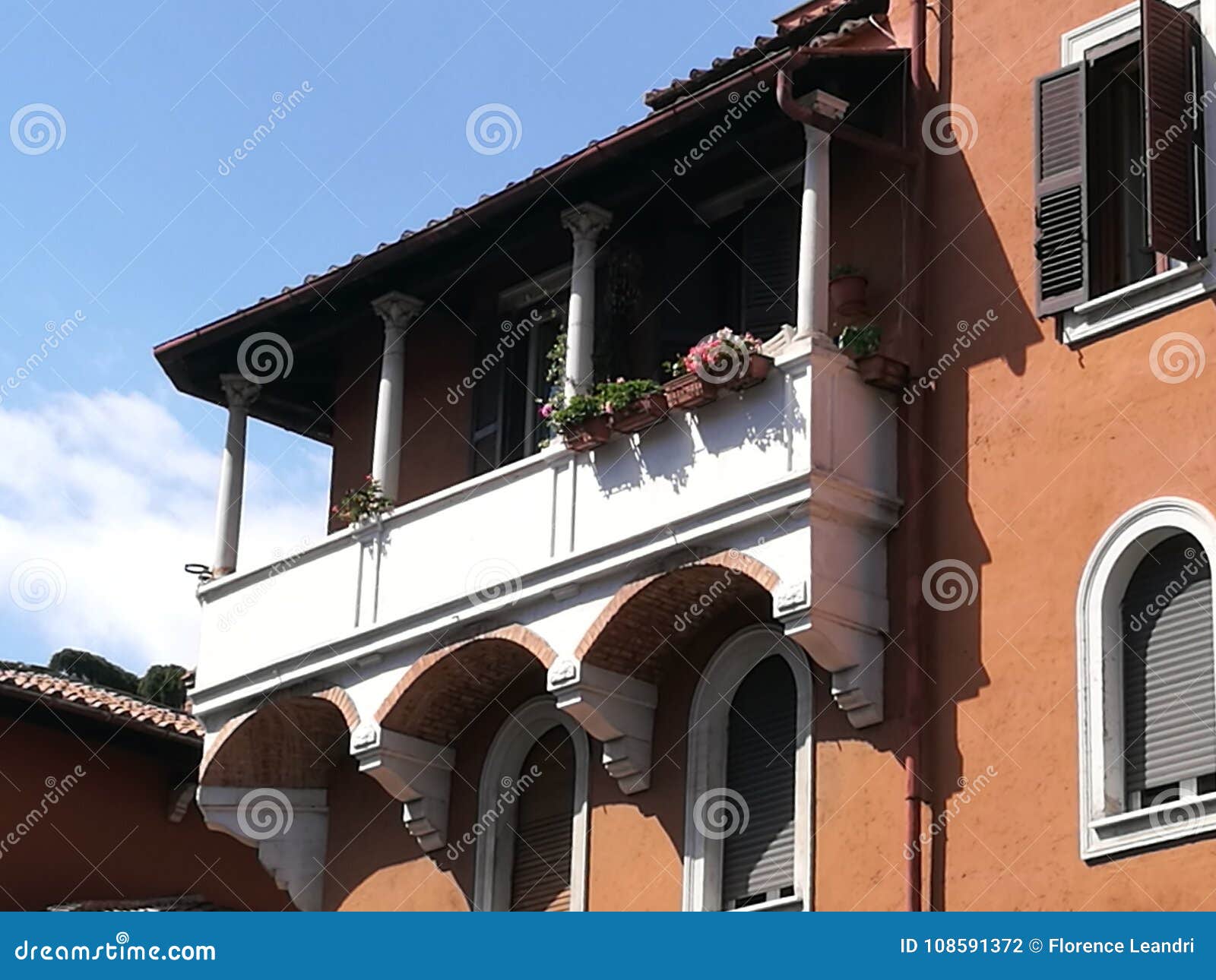 balcony with flowers in the garbatella district to rome in italy.